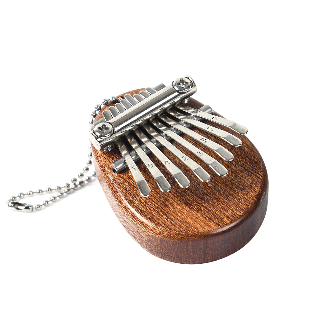 A Musical Instrument With Keys - 8 Key Mini Portable Thumb Piano